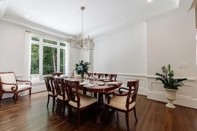 a view of a chair and table on the wooden floor
