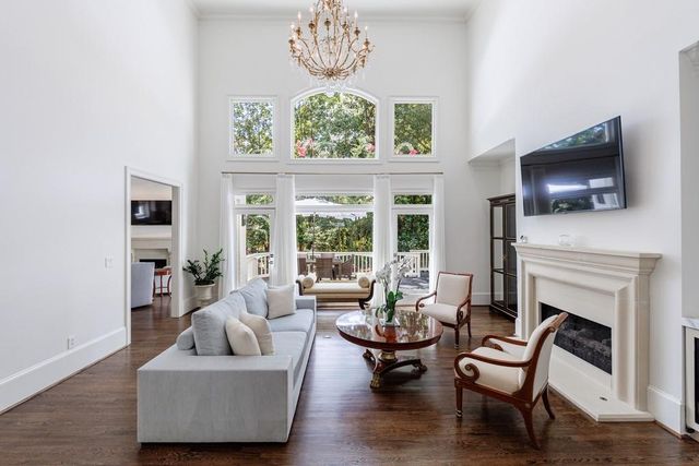 a view of a patio with table and chairs and potted plants