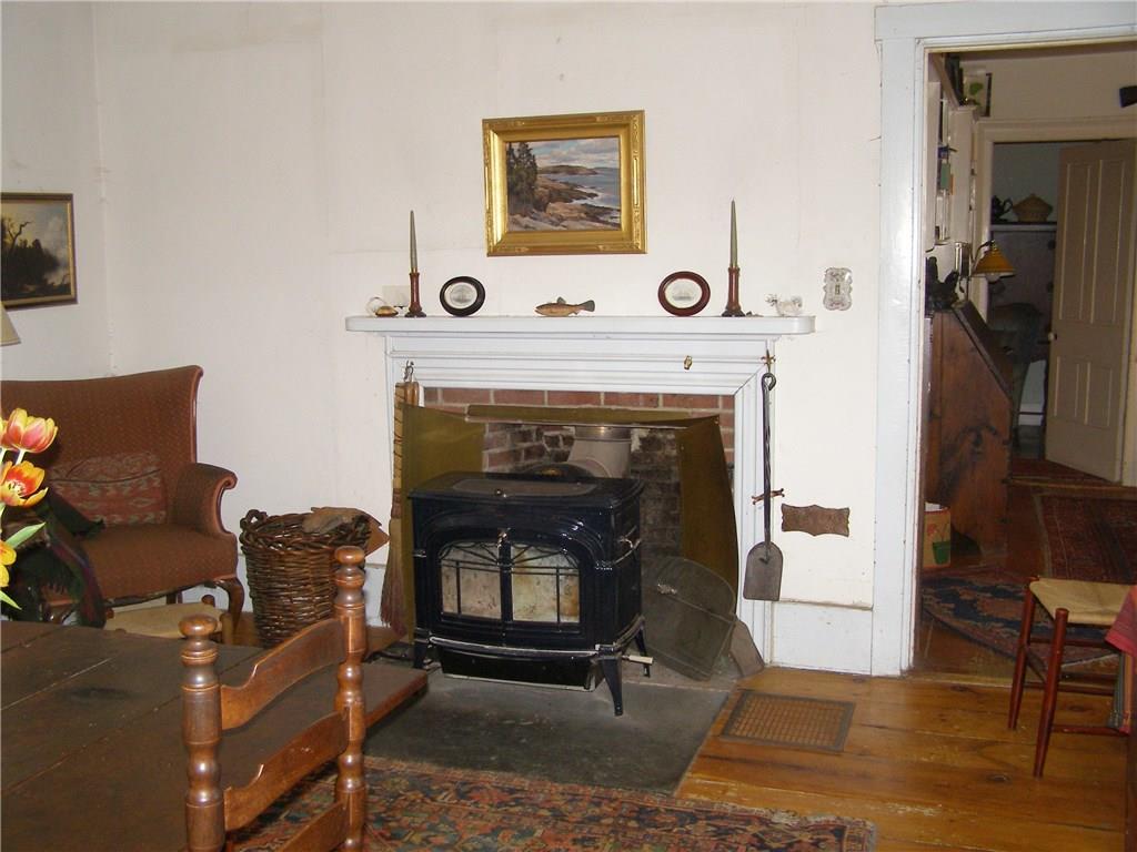 282 River Road Boothbay, ME 04537 - Photo 11 of 18 The living room with brick fireplace...