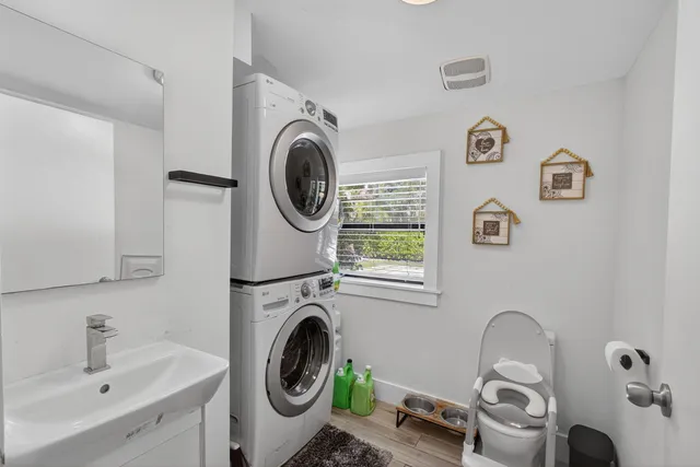 a bathroom with a toilet a sink and a shower
