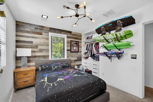 a balcony view with two chairs and a table