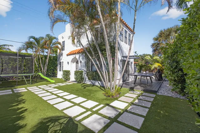 a kitchen that has a lot of cabinets a sink and a stove in it