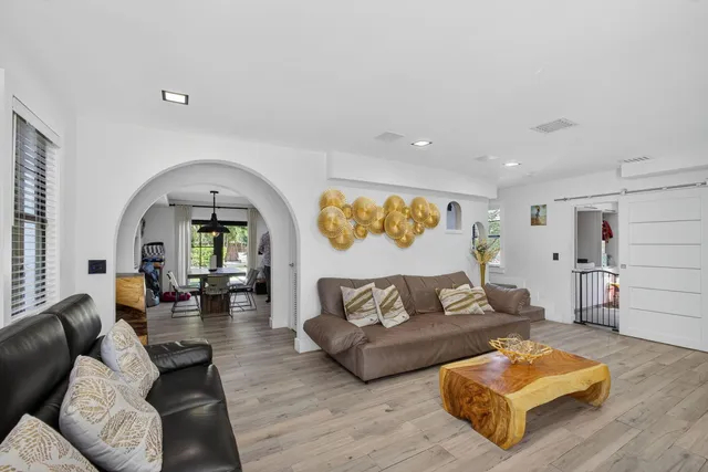 a workspace with furniture window and wooden floor