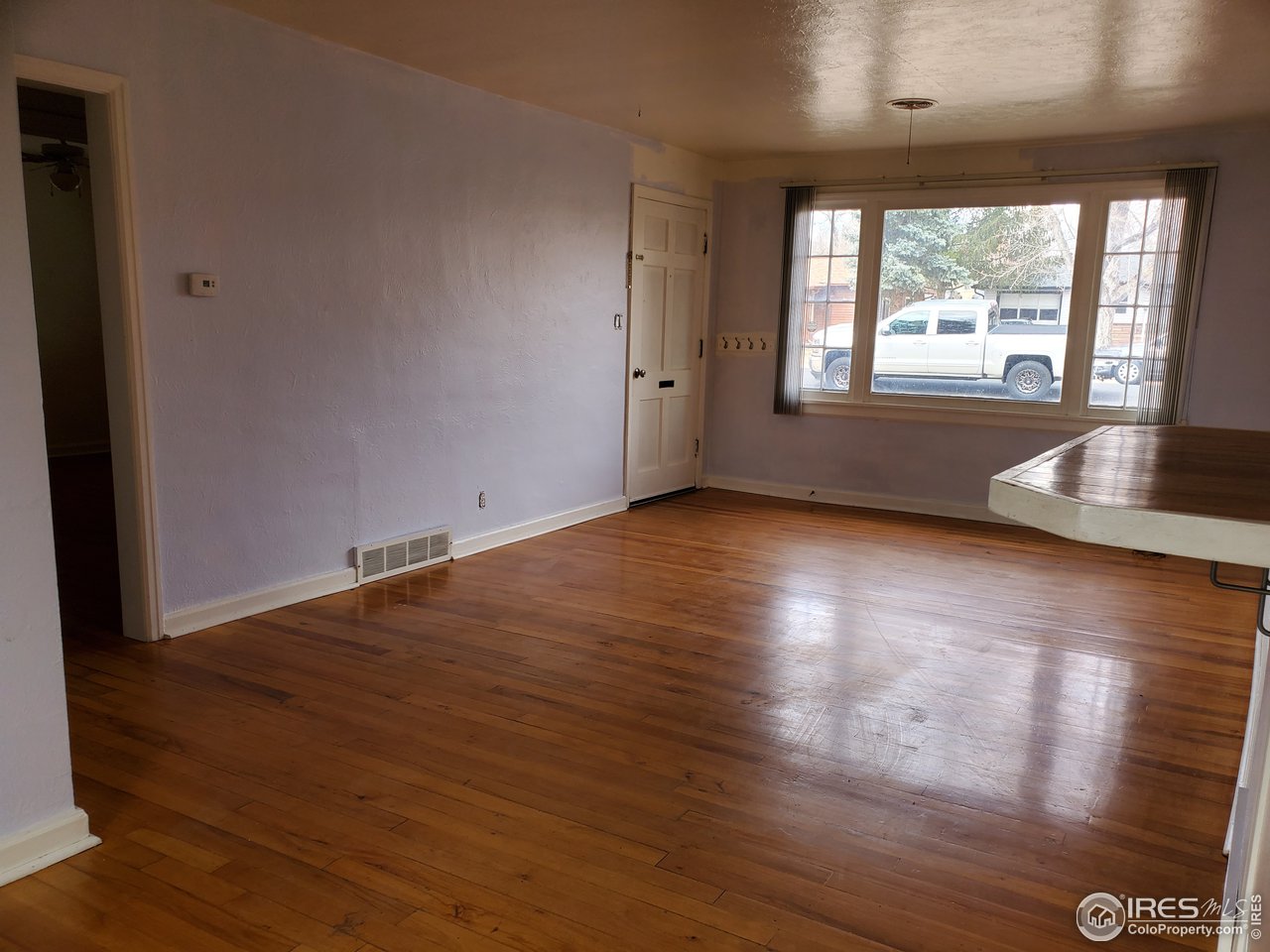 1026 23rd Street Road Greeley, CO 80631 - Photo 7 of 15 living room and entrance