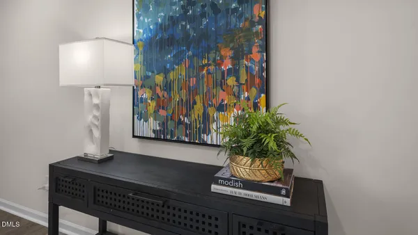 a vase with flowers sitting on a table