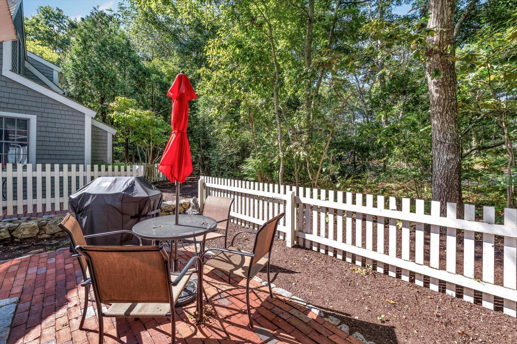 36 Brant Rock Road Mashpee, MA 02649 - Photo 17 of 23 a view of a patio with a table and chairs