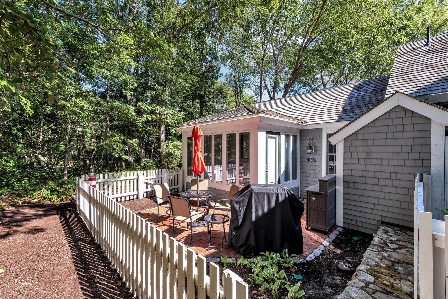 36 Brant Rock Road Mashpee, MA 02649 - Photo 18 of 23 a view of house with patio outdoor seating