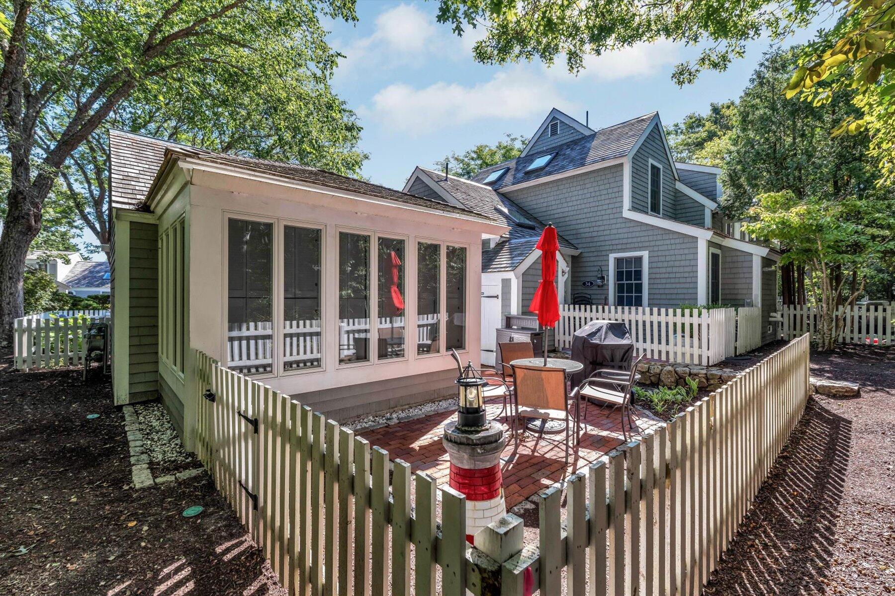 36 Brant Rock Road Mashpee, MA 02649 - Photo 19 of 23 a view of a house with backyard and porch