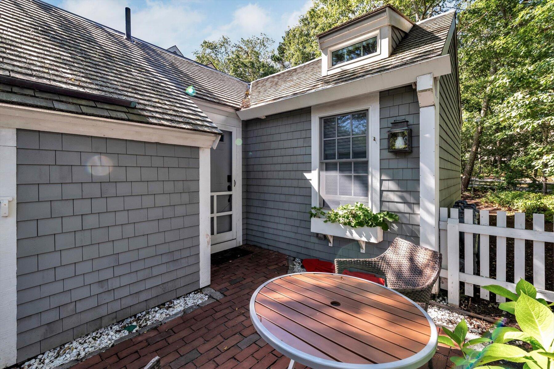 36 Brant Rock Road Mashpee, MA 02649 - Photo 3 of 23 a backyard of a house with seating space