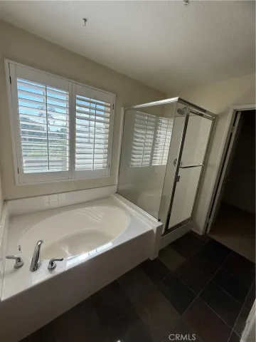 a white bath tub sitting next to a window