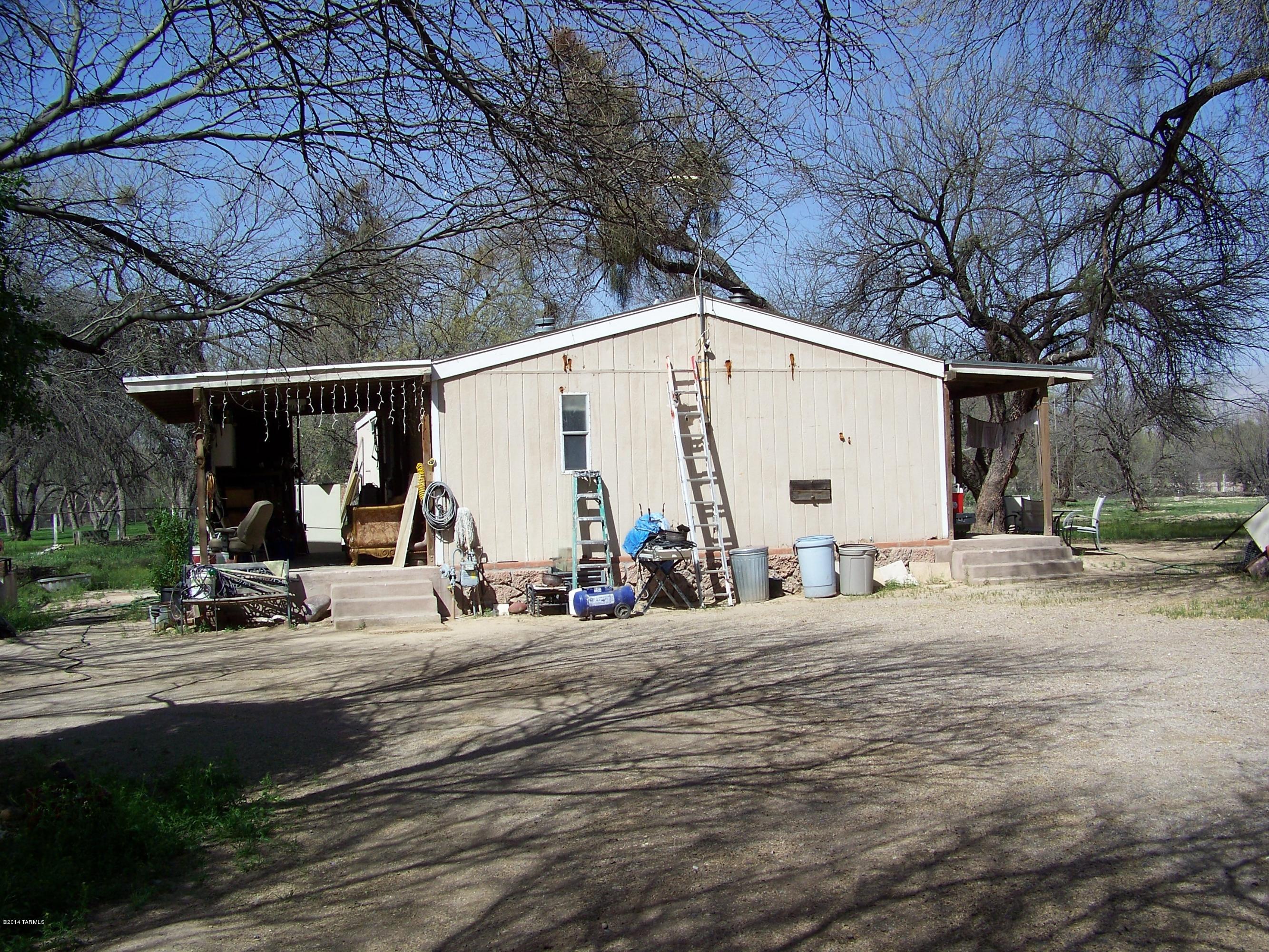 8051 East Tanque Verde Road Tucson, AZ 85749 - Photo 20 of 24 a view of a house with backyard