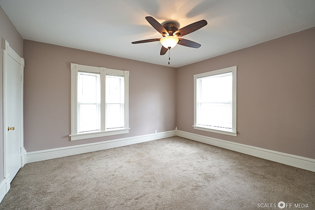 515 Walnut Avenue Elgin, IL 60123 - Photo 17 of 28 an empty room with windows and fan