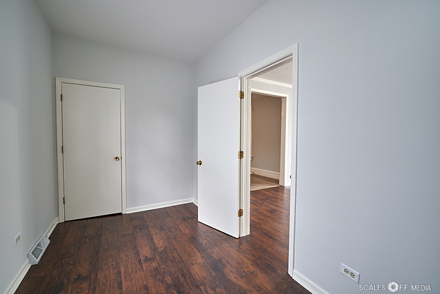 515 Walnut Avenue Elgin, IL 60123 - Photo 18 of 28 a view of an empty room with wooden floor