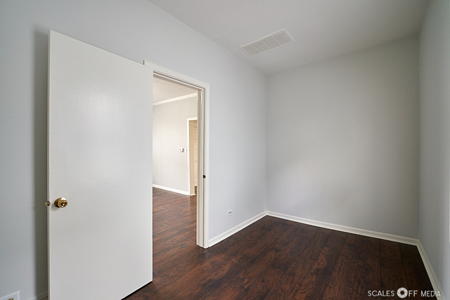 515 Walnut Avenue Elgin, IL 60123 - Photo 19 of 28 a view of an empty room with wooden floor