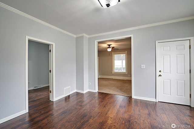 515 Walnut Avenue Elgin, IL 60123 - Photo 5 of 28 wooden floor with white walls