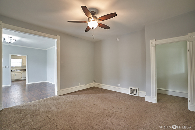 515 Walnut Avenue Elgin, IL 60123 - Photo 6 of 28 an empty room with closet and windows