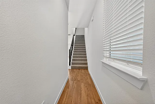 a large kitchen with a table and chairs