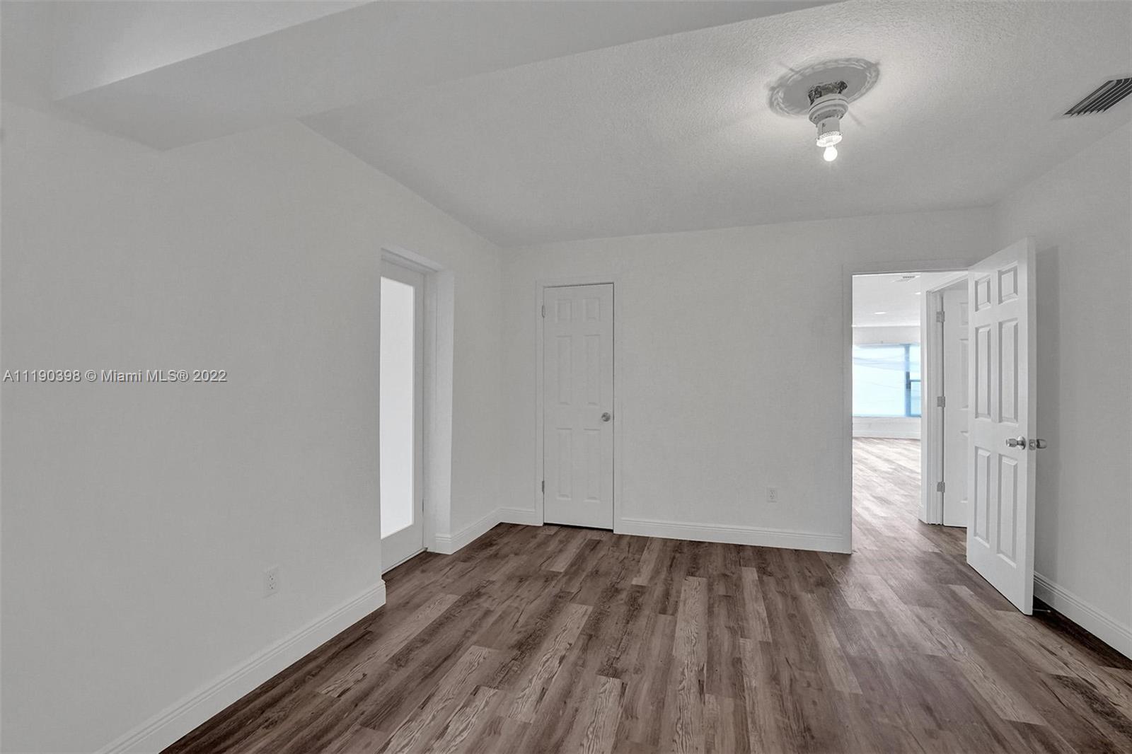 730 Northwest 18th Street Pompano Beach, FL 33060 - Photo 35 of 56 wooden floor in an empty room