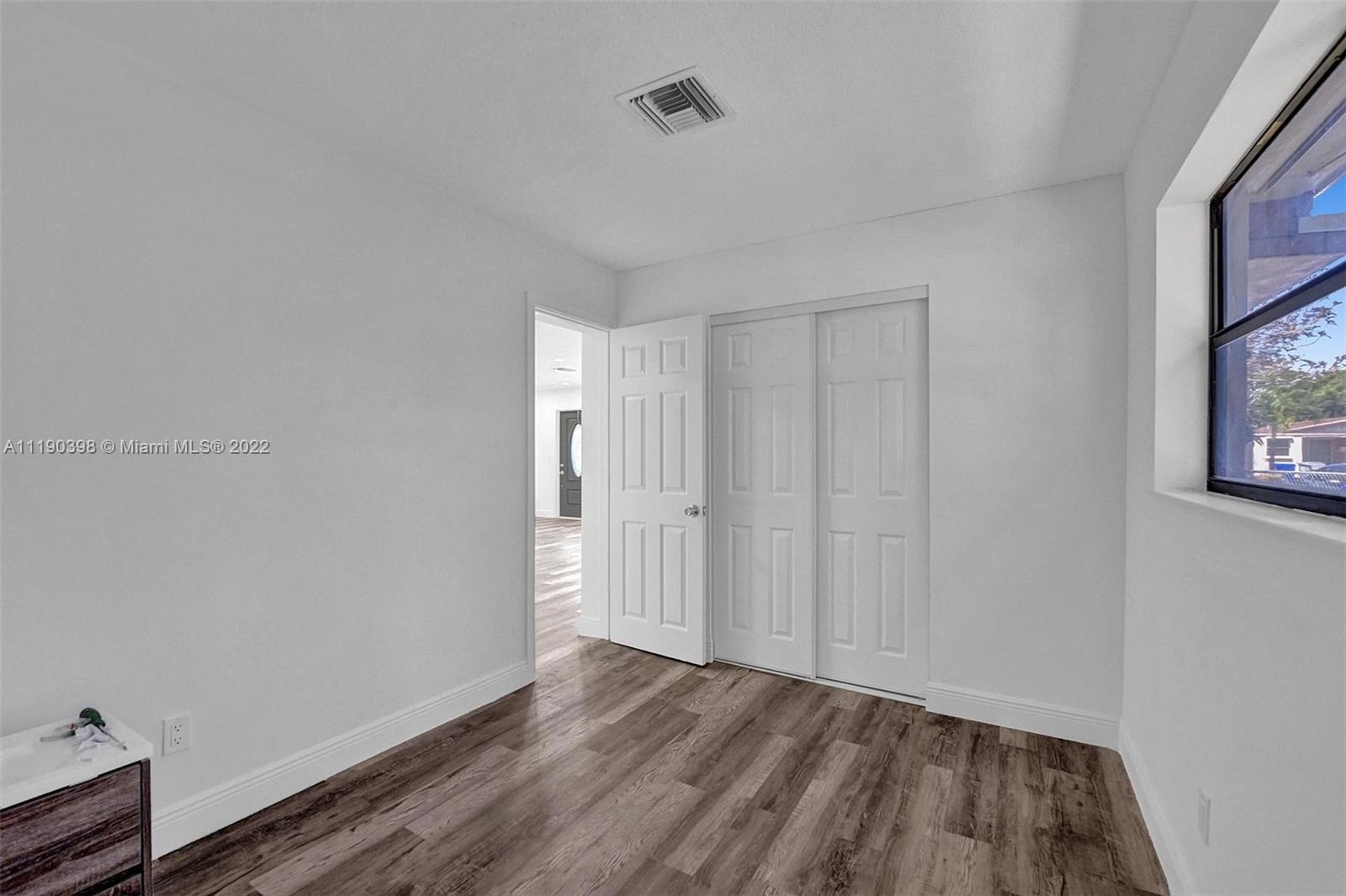 730 Northwest 18th Street Pompano Beach, FL 33060 - Photo 47 of 56 a view of an empty room and wooden floor