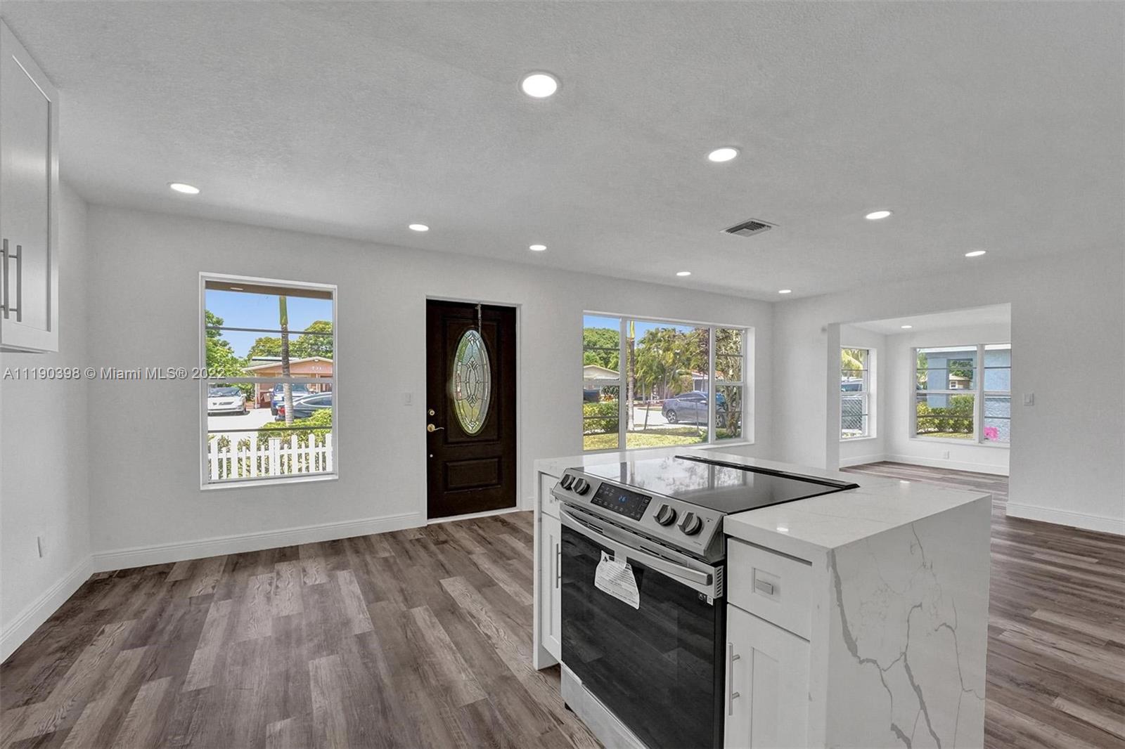 730 Northwest 18th Street Pompano Beach, FL 33060 - Photo 9 of 56 a kitchen that has a sink and a stove top oven