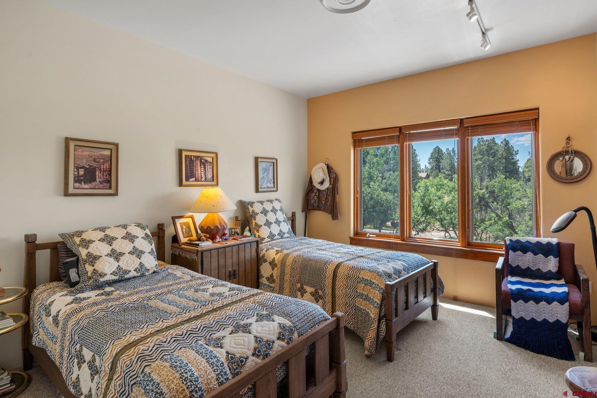 285 South Fork Road Durango, CO 81303 - Photo 21 of 31 a bedroom with two beds and a large window