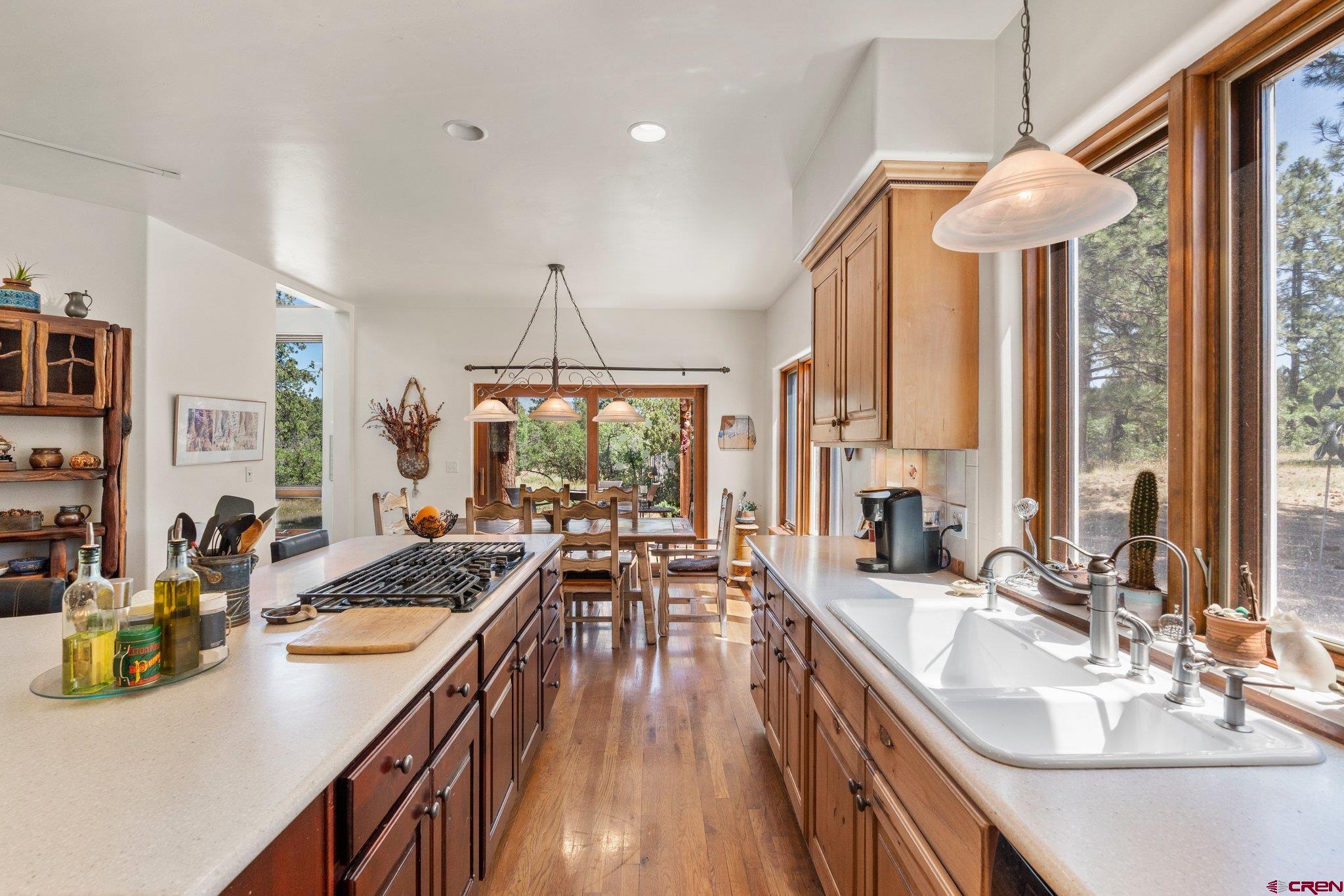 285 South Fork Road Durango, CO 81303 - Photo 3 of 31 a kitchen with sink refrigerator and large windows