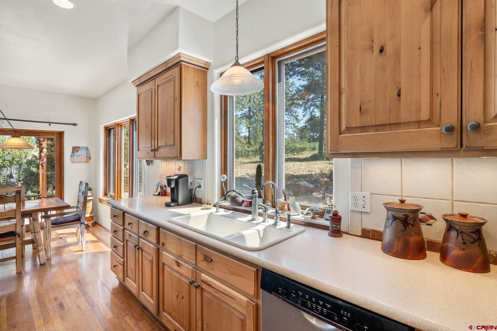 285 South Fork Road Durango, CO 81303 - Photo 6 of 31 a kitchen with sink and large window