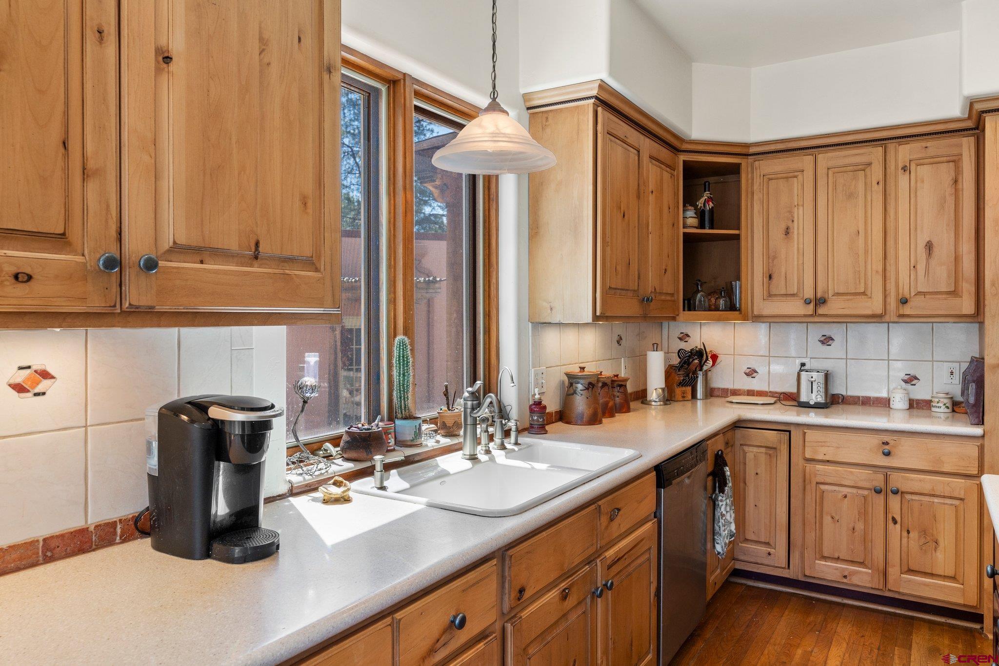 285 South Fork Road Durango, CO 81303 - Photo 7 of 31 a kitchen with sink and cabinets