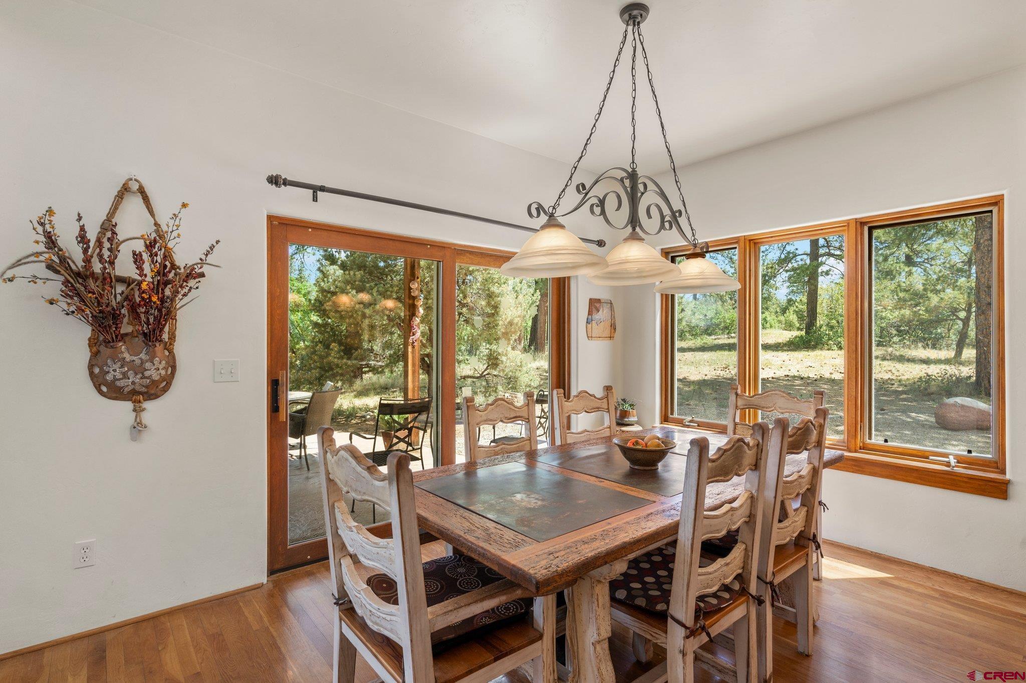 285 South Fork Road Durango, CO 81303 - Photo 8 of 31 a view of a dining room with furniture window and wooden floor