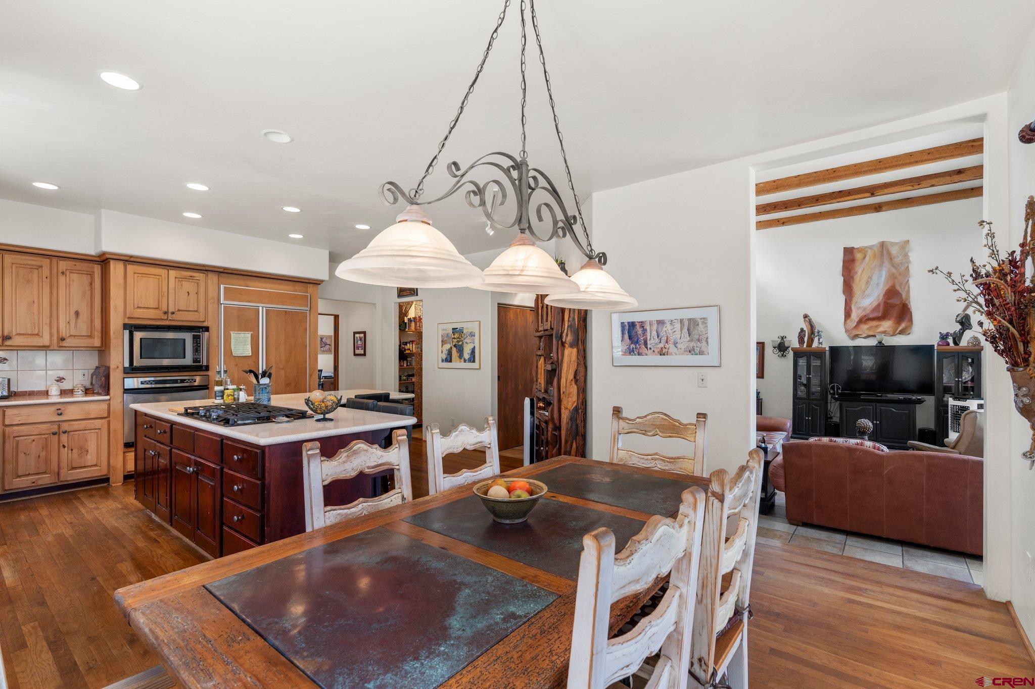 285 South Fork Road Durango, CO 81303 - Photo 9 of 31 a living room with stainless steel appliances granite countertop furniture a rug kitchen view and a chandelier