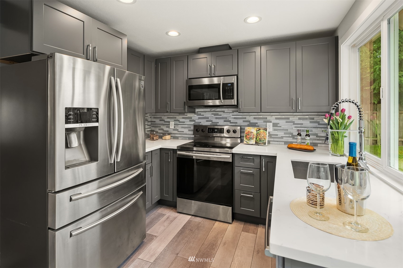 4308 Southeast 2nd Place Renton, WA 98059 - Photo 8 of 26 a kitchen with a refrigerator stove and sink