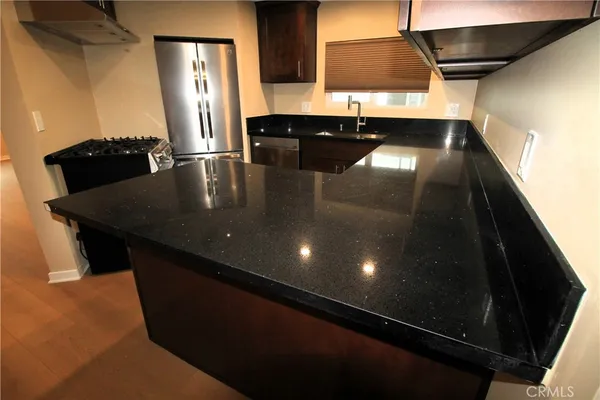 a bathroom with a sink a shower and a mirror