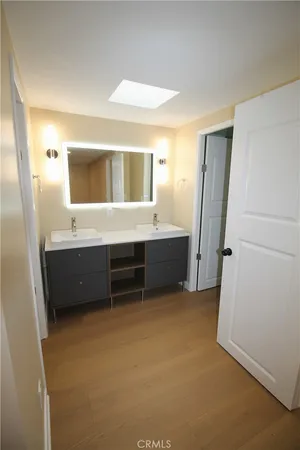 a bathroom with a glass shower door