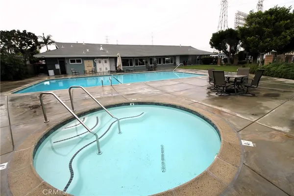 a room with wooden floor and windows