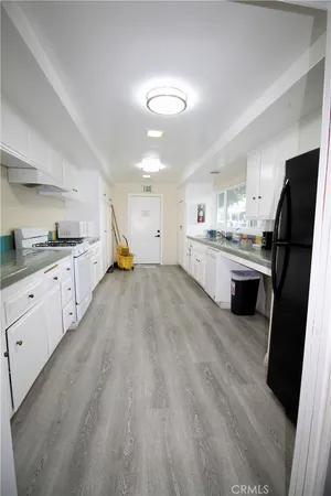 a room with pool table and windows