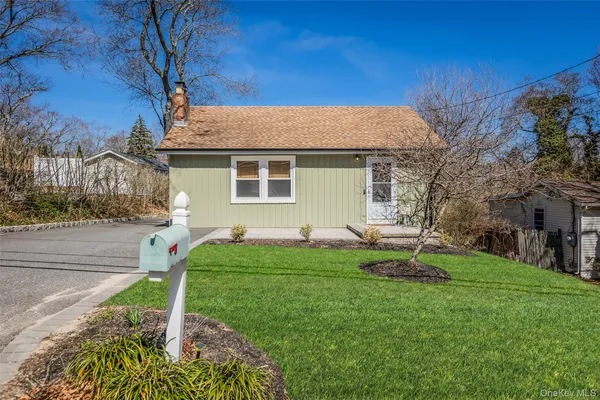 a view of a backyard with table and chairs and a fire pit