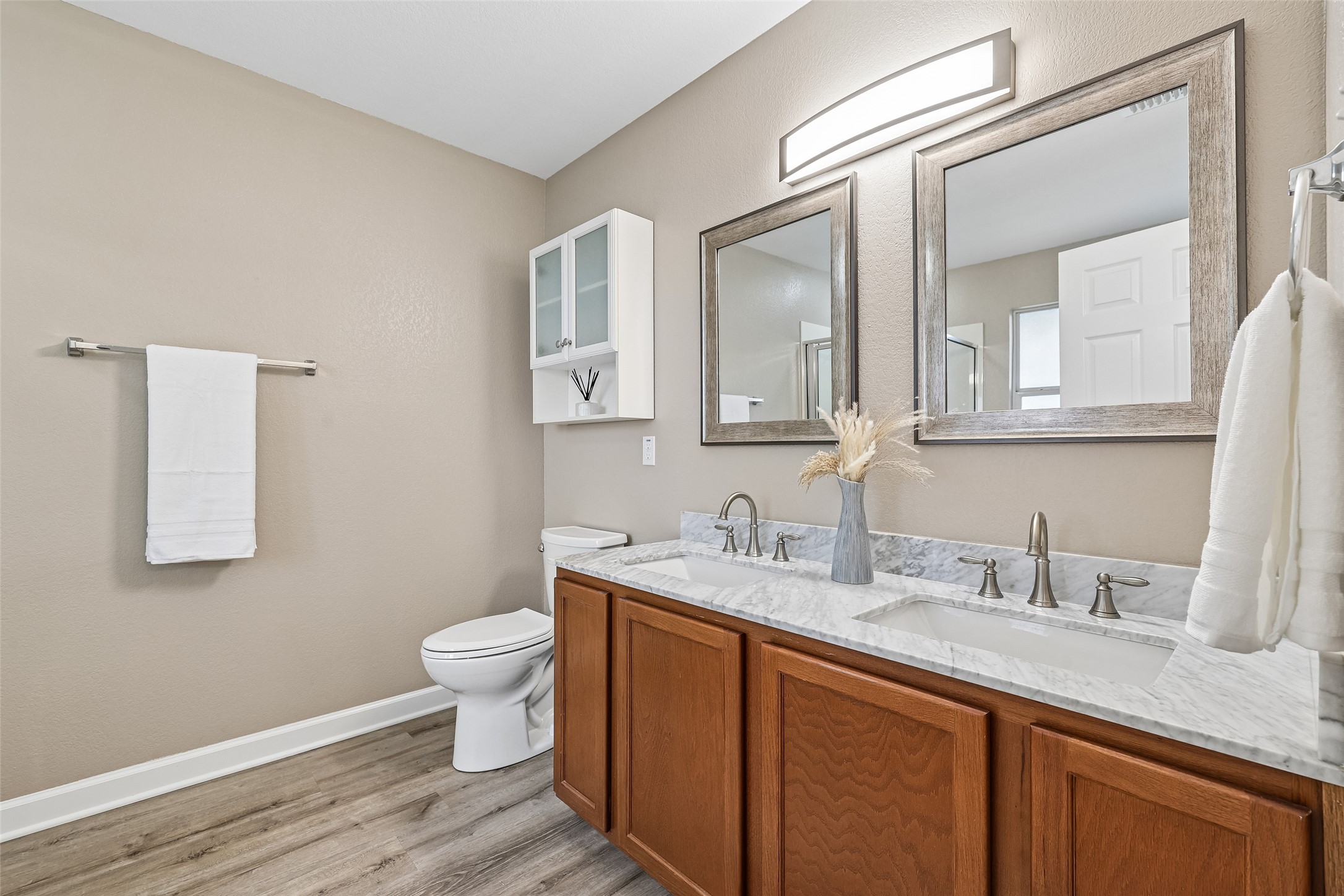 152 Grant Way Kyle, TX 78640 - Photo 27 of 39 a bathroom with a sink vanity and a toilet