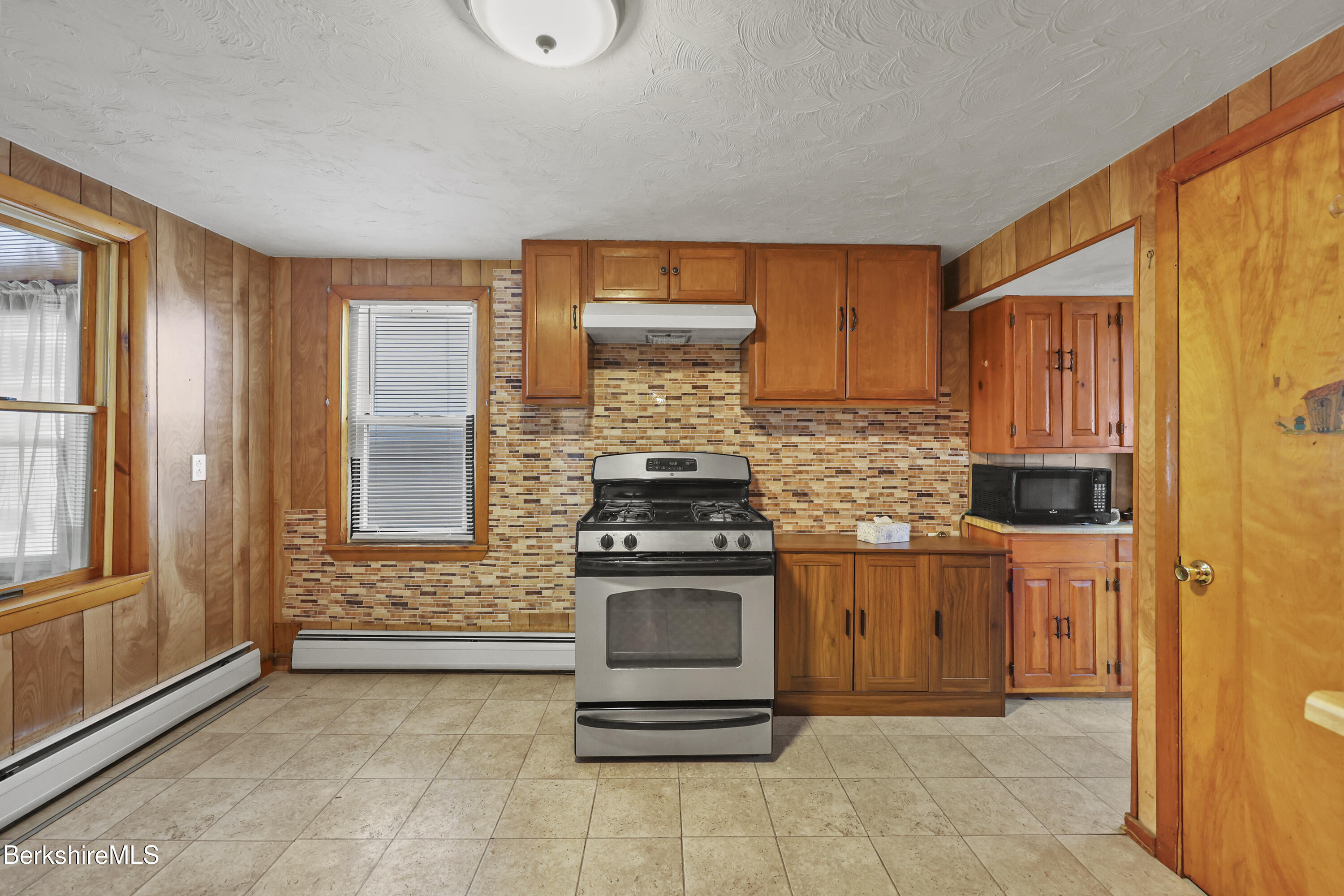 176 North Summer Street Adams, MA 01220 - Photo 12 of 31 a kitchen with a stove and a cabinet