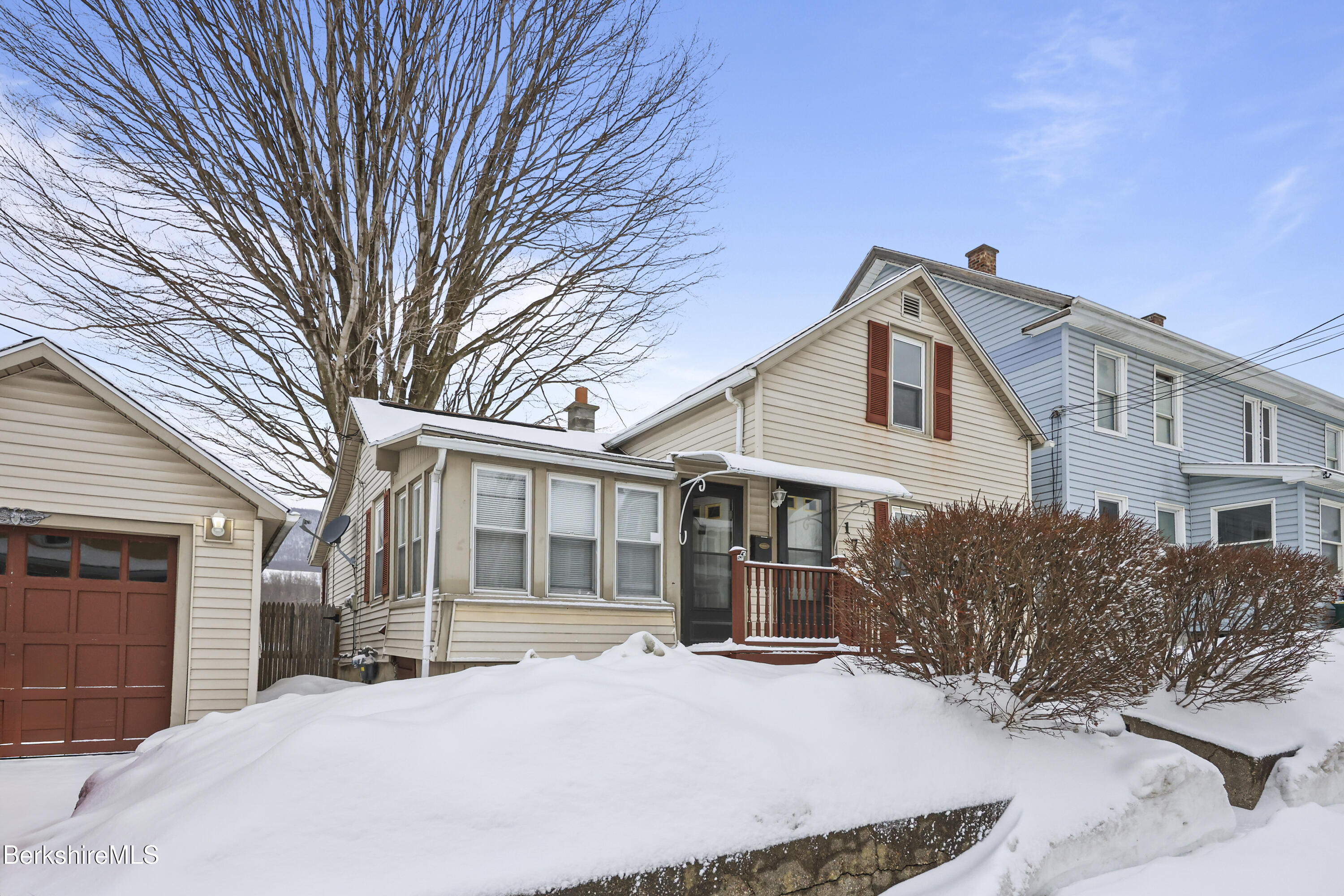 176 North Summer Street Adams, MA 01220 - Photo 3 of 31 a front view of a house with a yard covered in snow