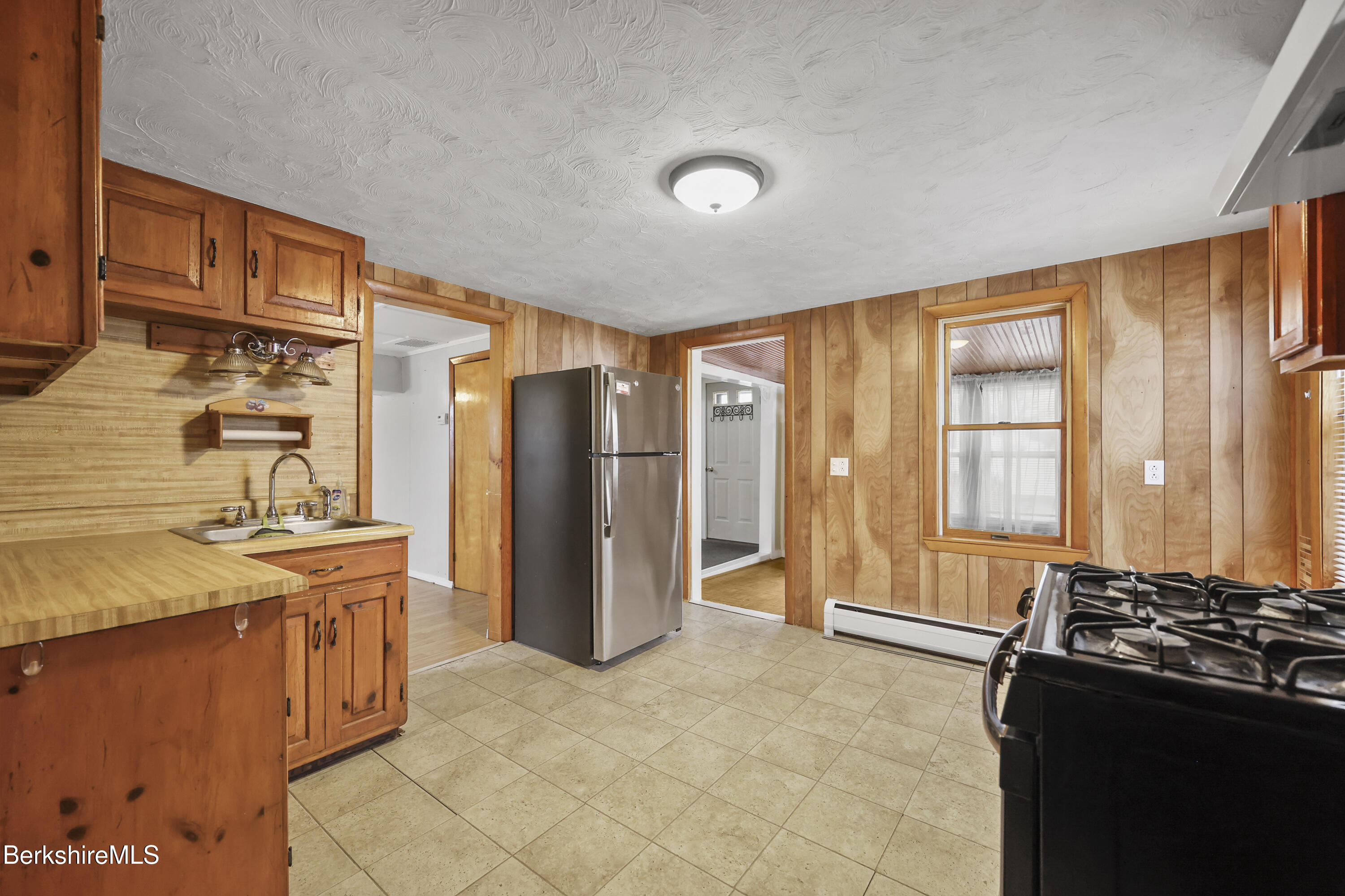 176 North Summer Street Adams, MA 01220 - Photo 7 of 31 a kitchen with stainless steel appliances granite countertop a refrigerator and a stove