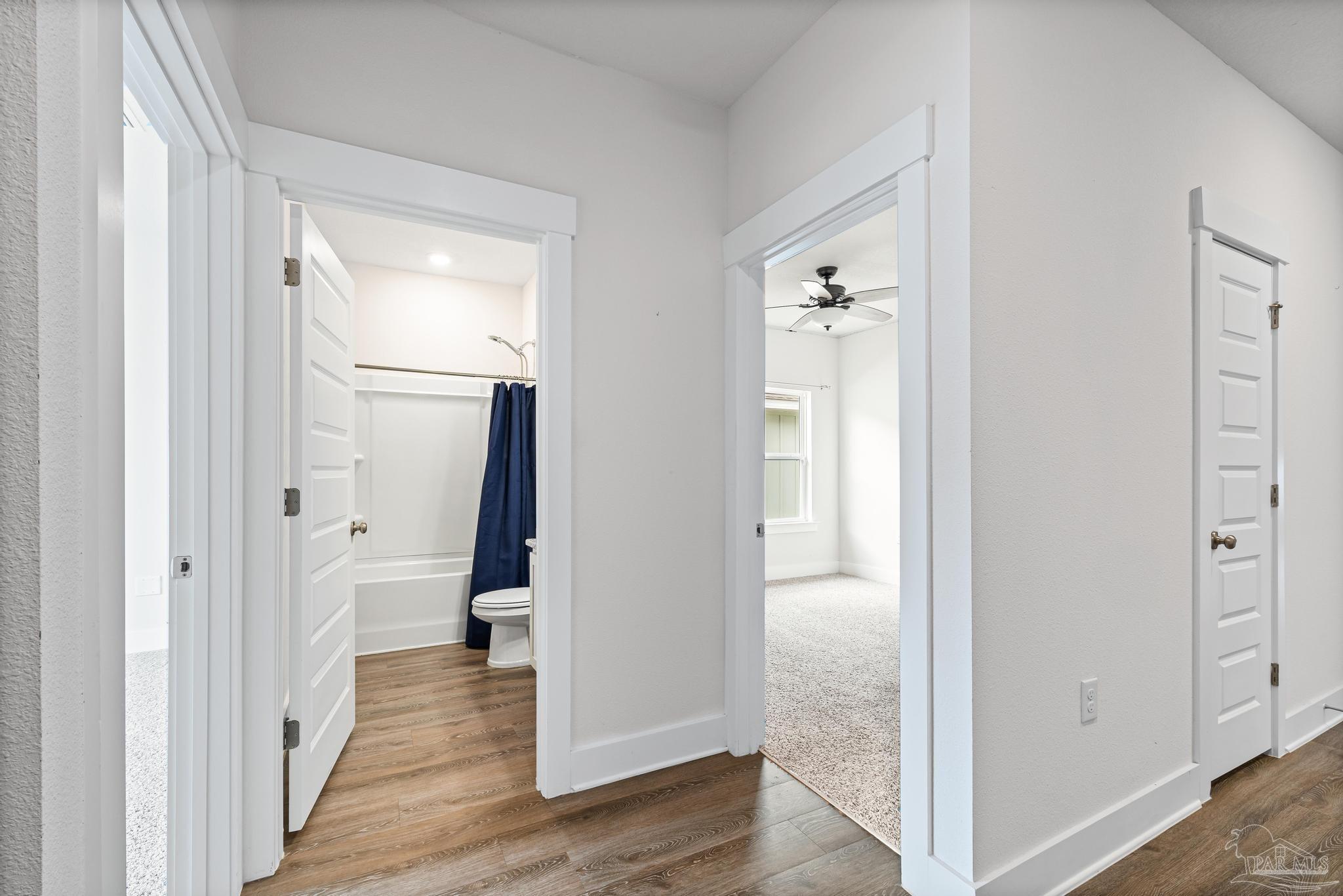 4074 Blaney Lane Pace, FL 32571 - Photo 15 of 59 a view of a hallway with wooden floor and closet