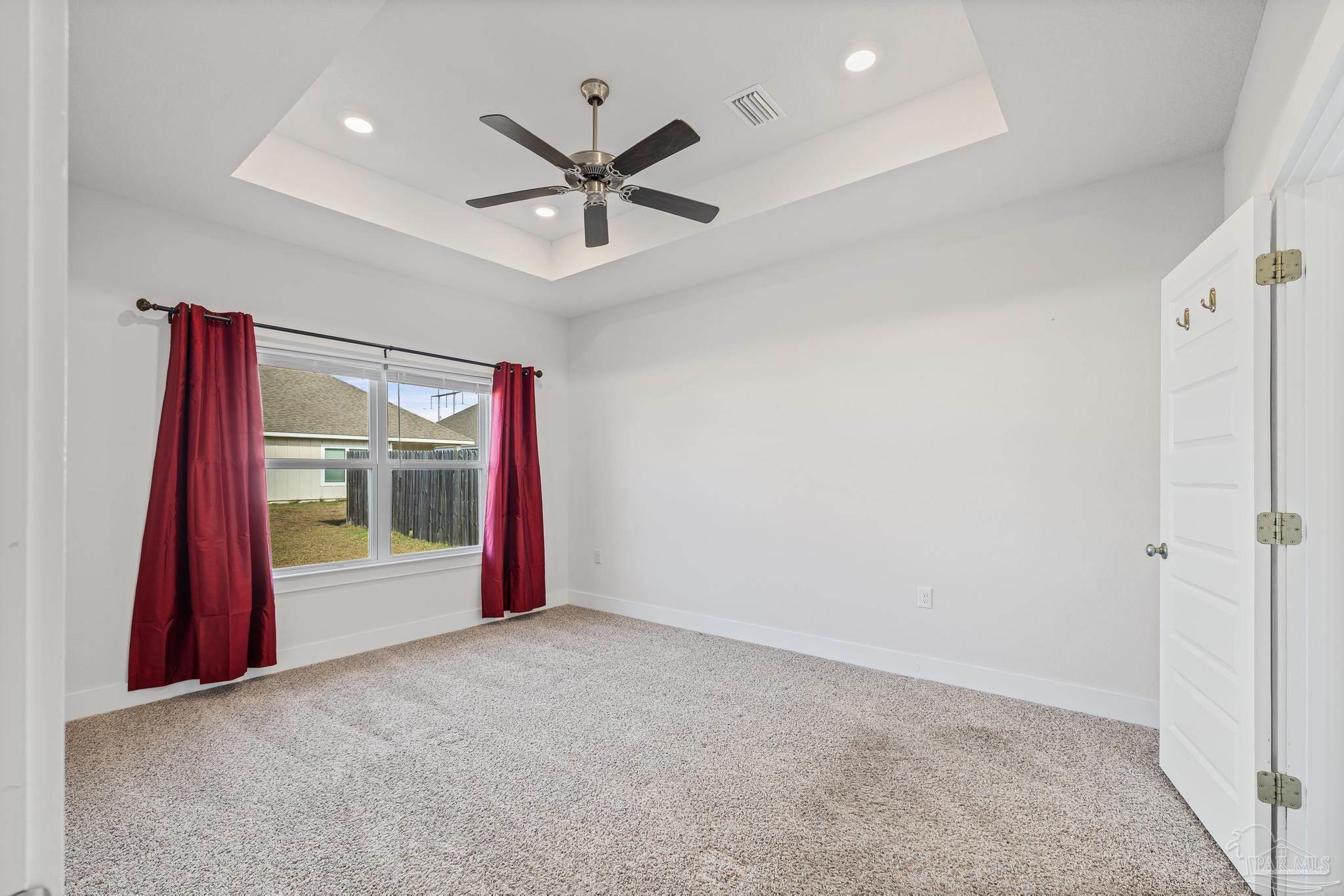4074 Blaney Lane Pace, FL 32571 - Photo 16 of 59 a view of a livingroom with a ceiling fan and window