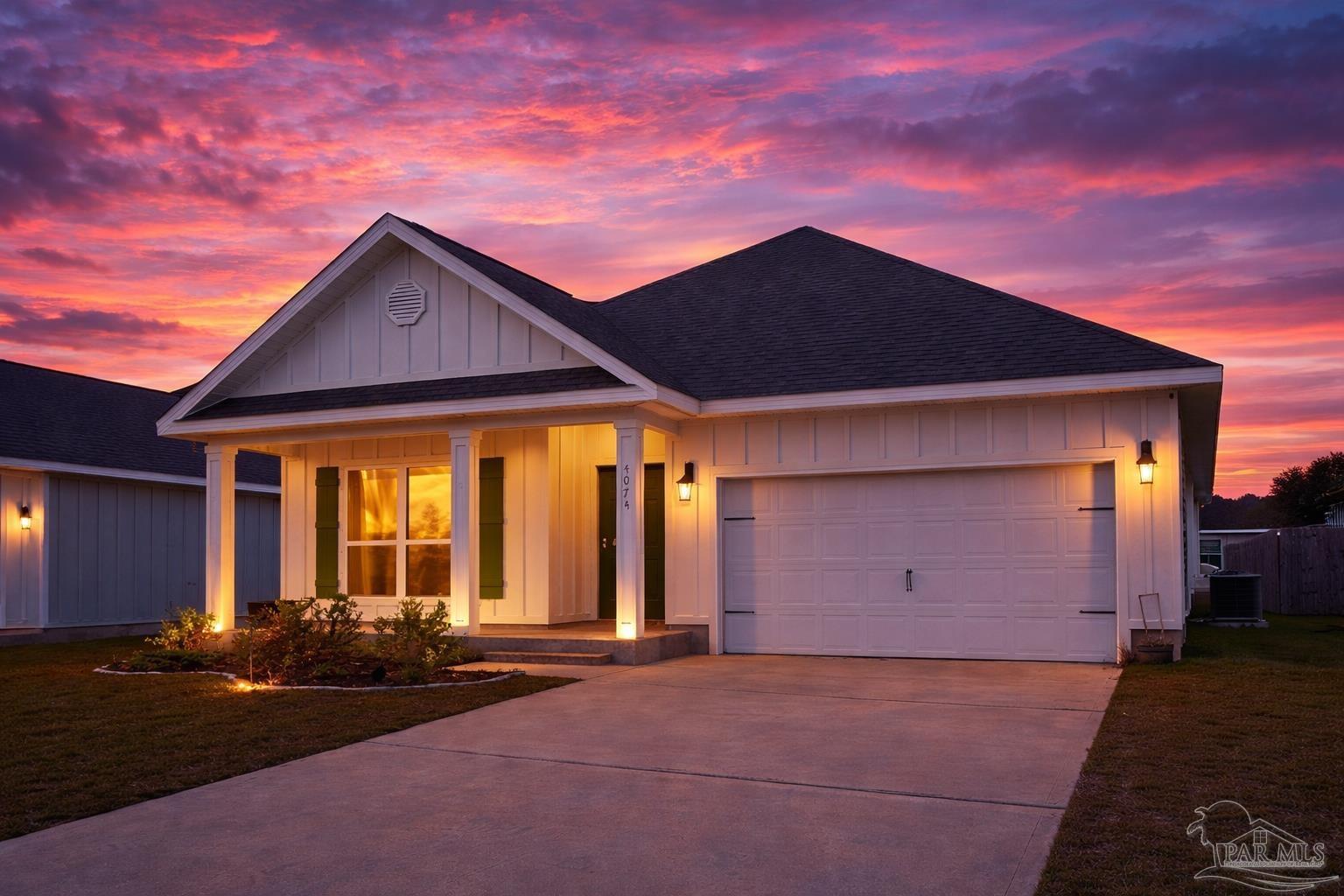 4074 Blaney Lane Pace, FL 32571 - Photo 2 of 59 a front view of a house with a yard and garage