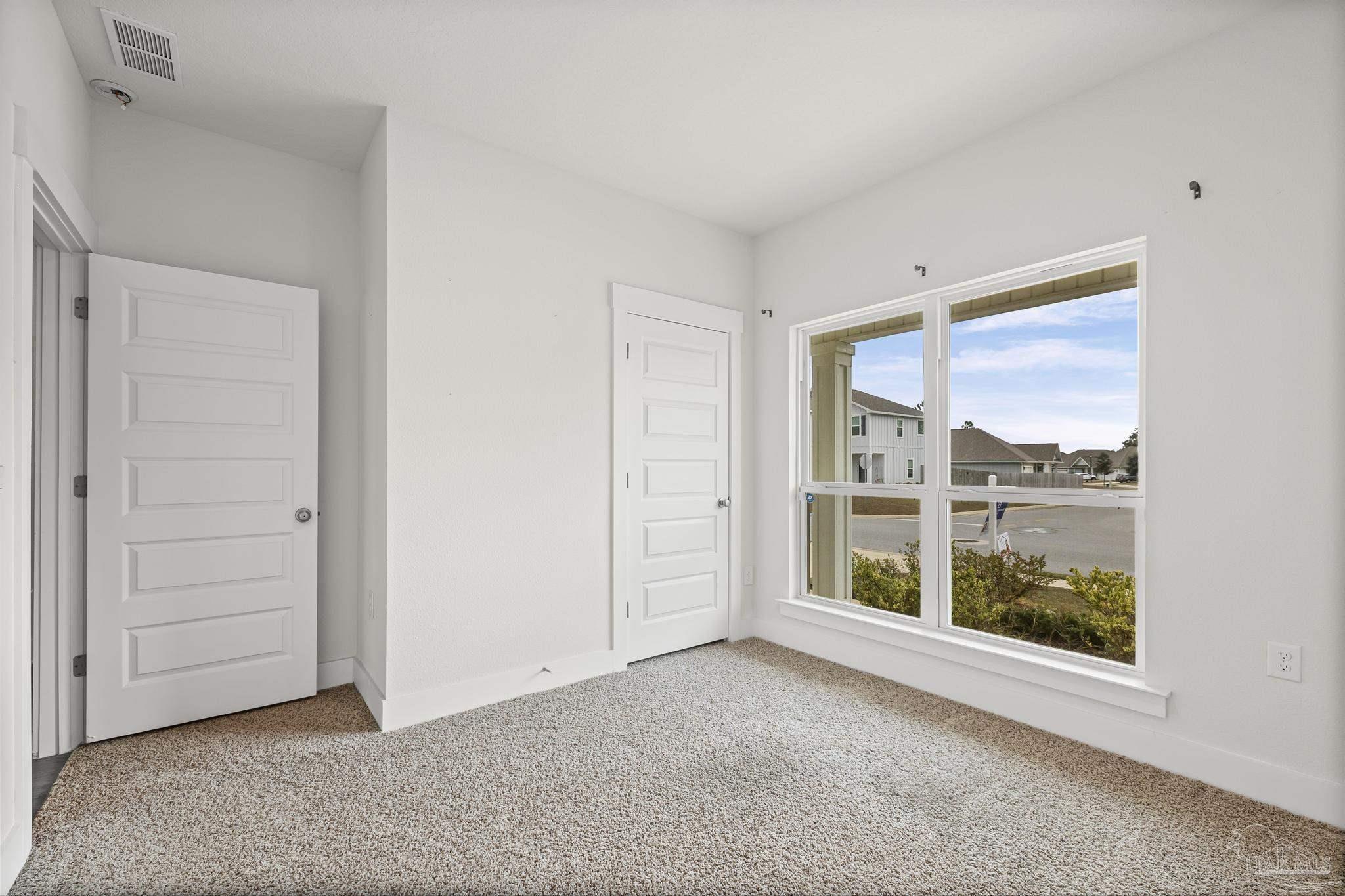 4074 Blaney Lane Pace, FL 32571 - Photo 25 of 59 an empty room with windows