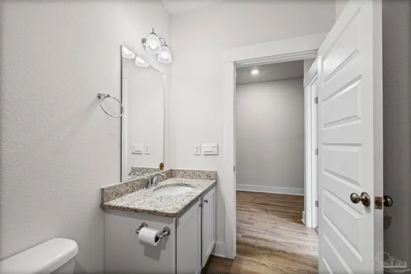 a view of hallway with wooden floor