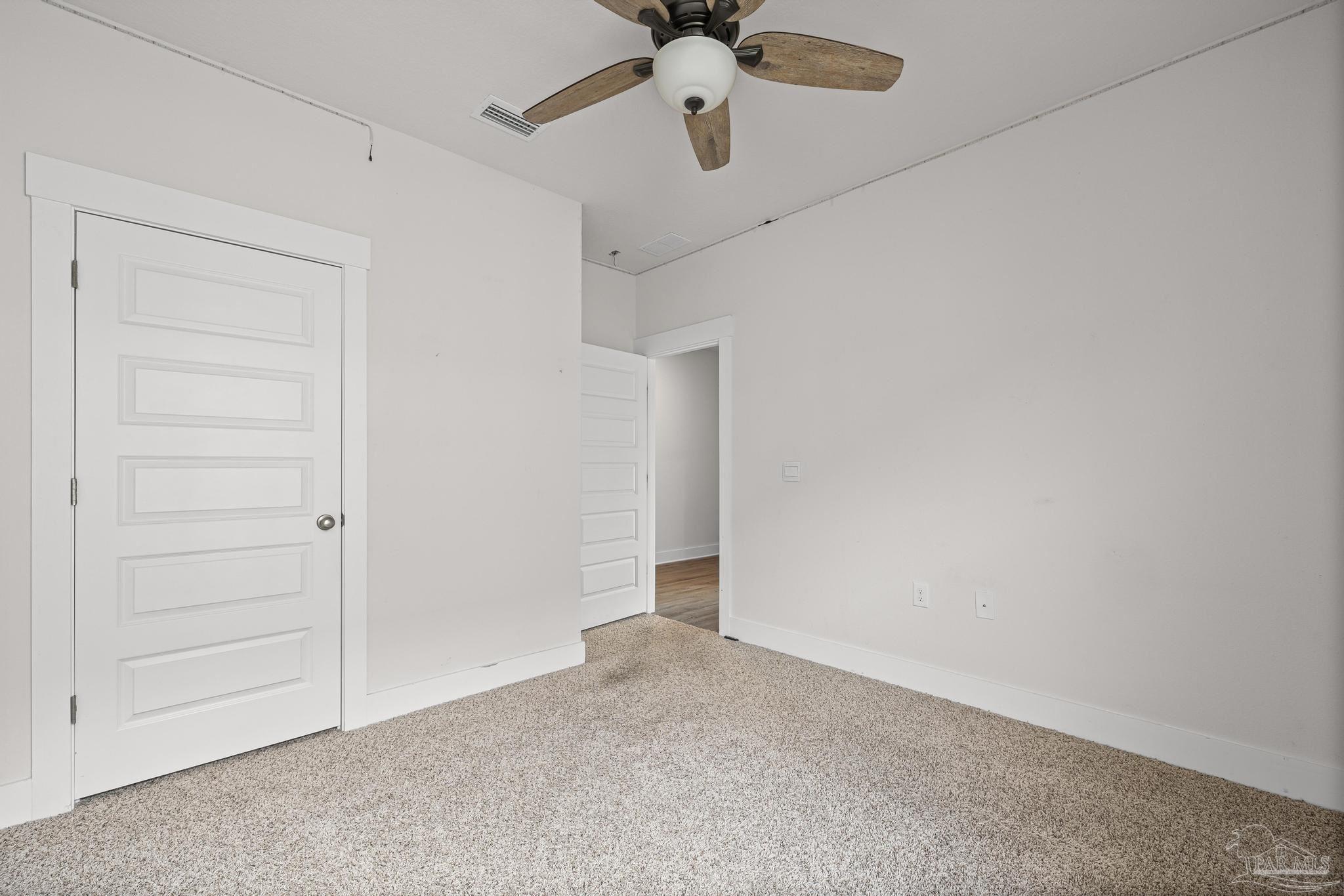 4074 Blaney Lane Pace, FL 32571 - Photo 30 of 59 an empty room with chandelier fan