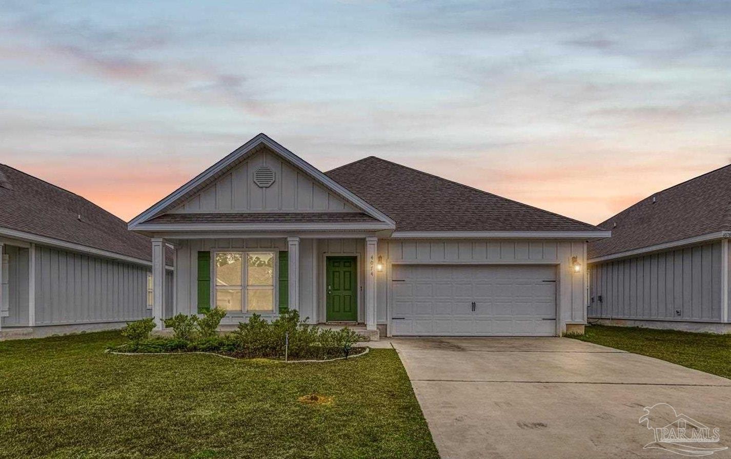4074 Blaney Lane Pace, FL 32571 - Photo 3 of 59 a front view of house with yard and green space