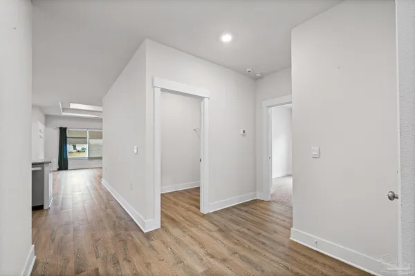 a kitchen with stainless steel appliances granite countertop a stove and a refrigerator