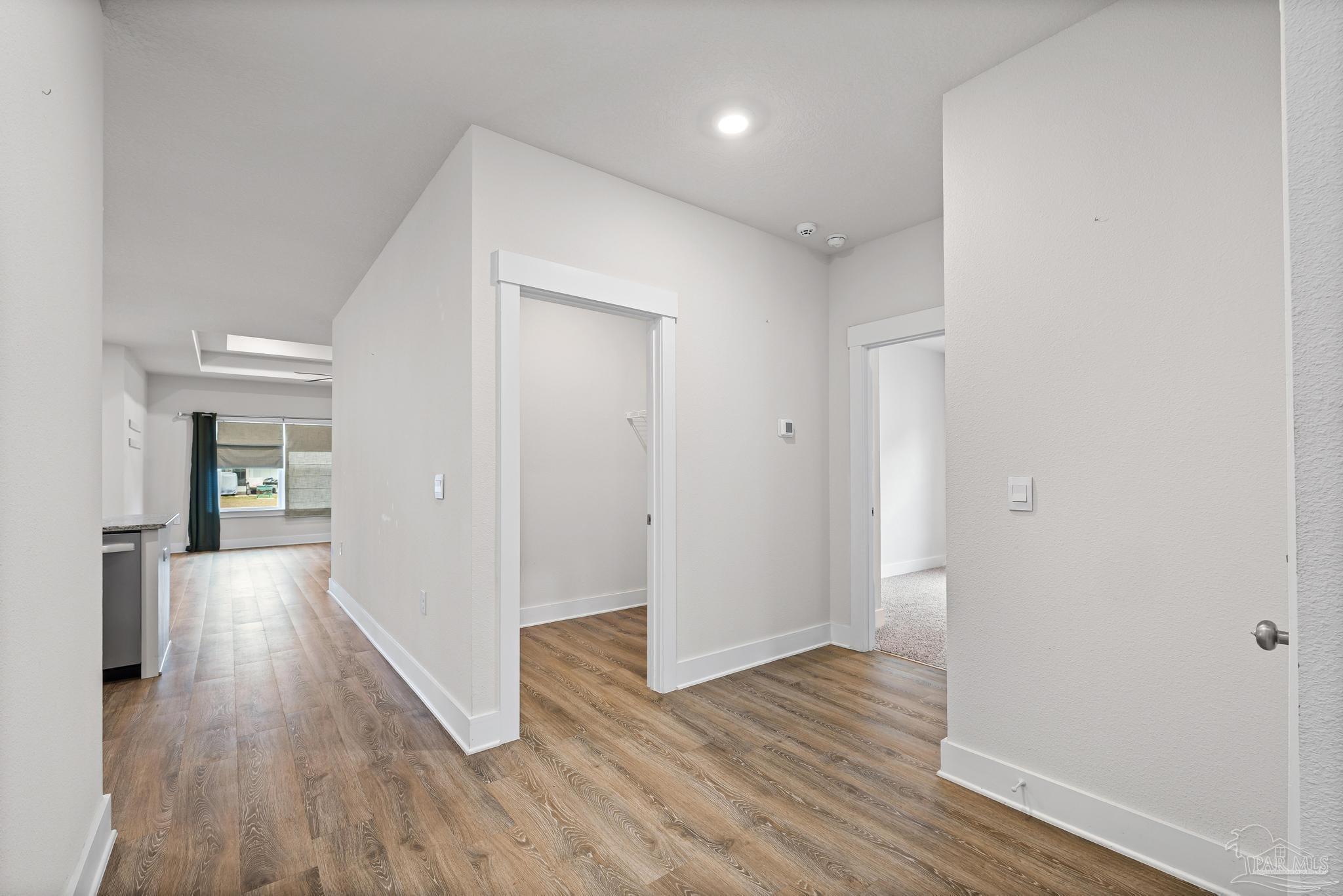 4074 Blaney Lane Pace, FL 32571 - Photo 31 of 59 a view of hallway with wooden floor