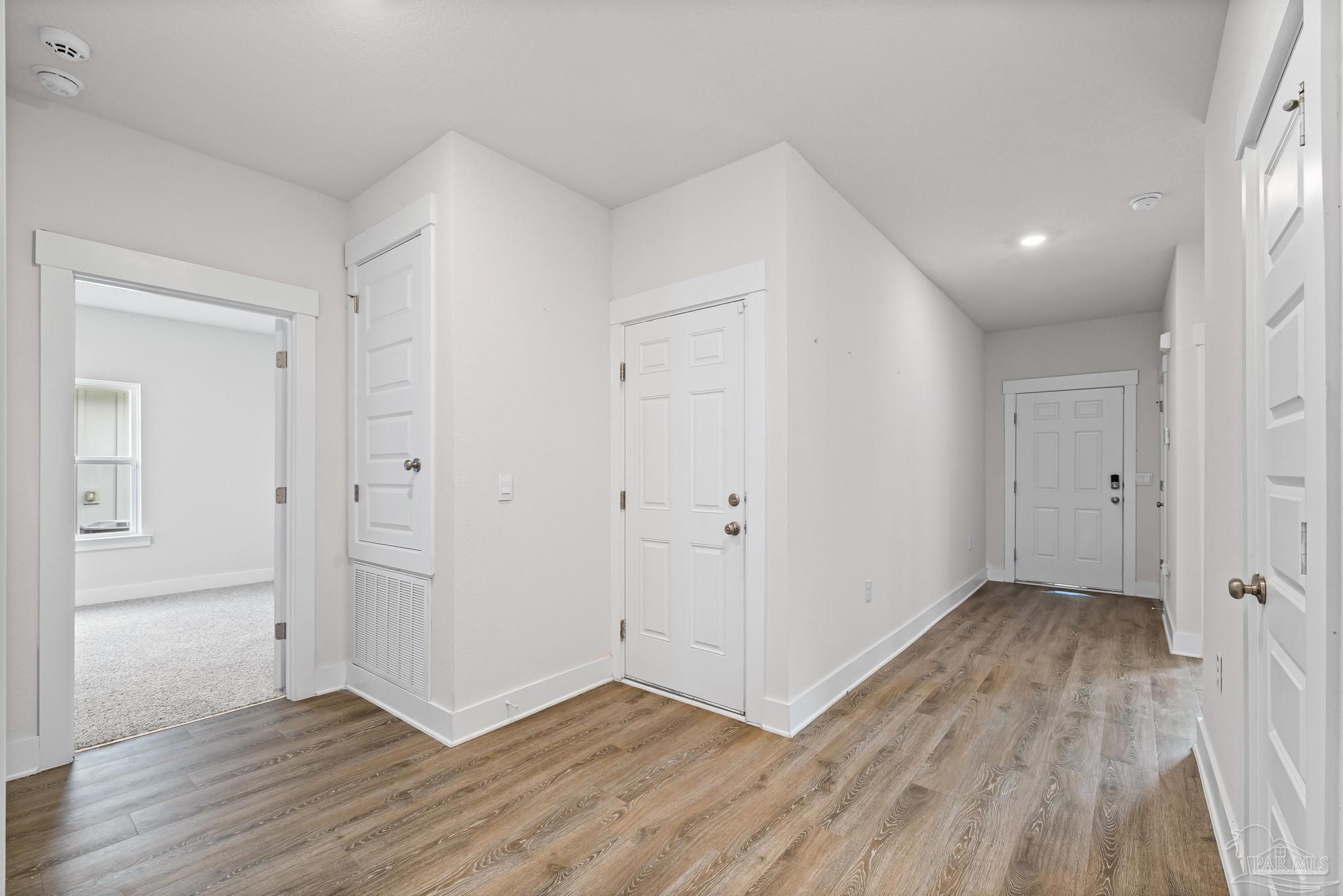 4074 Blaney Lane Pace, FL 32571 - Photo 32 of 59 wooden floor in an empty room with a window
